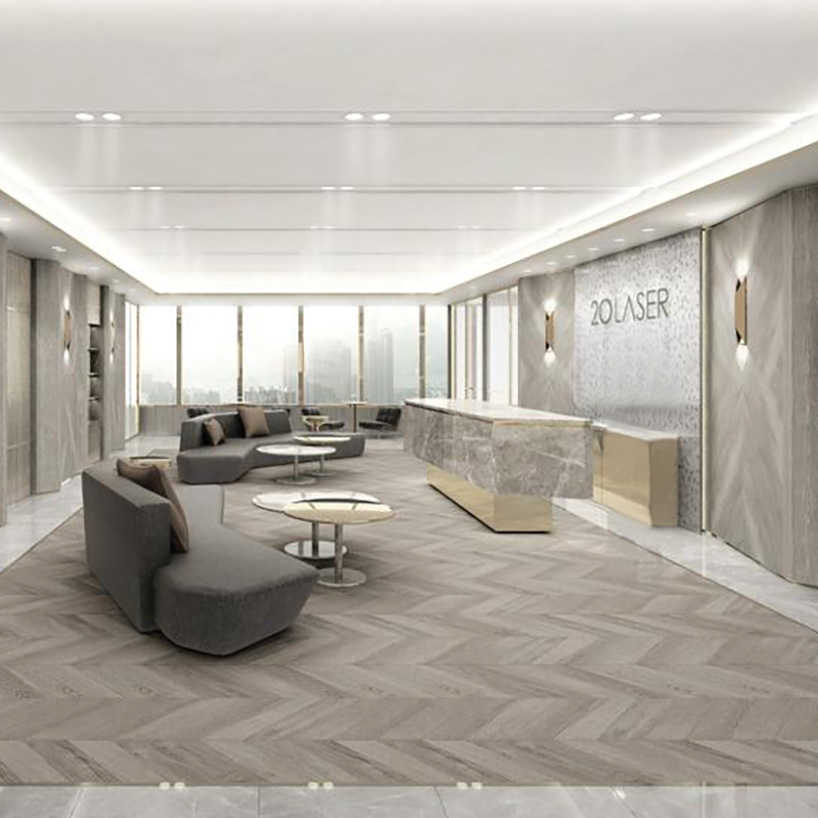 a lobby with a reception desk and couches